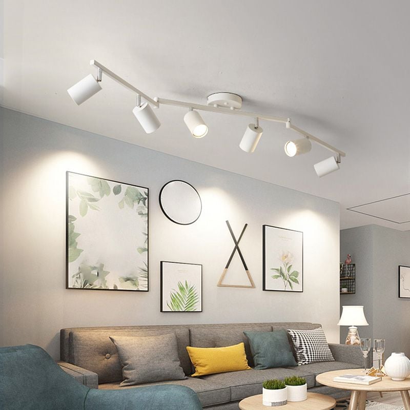 White Freja six-head spotlight above a grey sofa