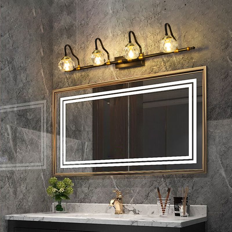 Kristy four-light crystal fixture above a rectangular bathroom mirror