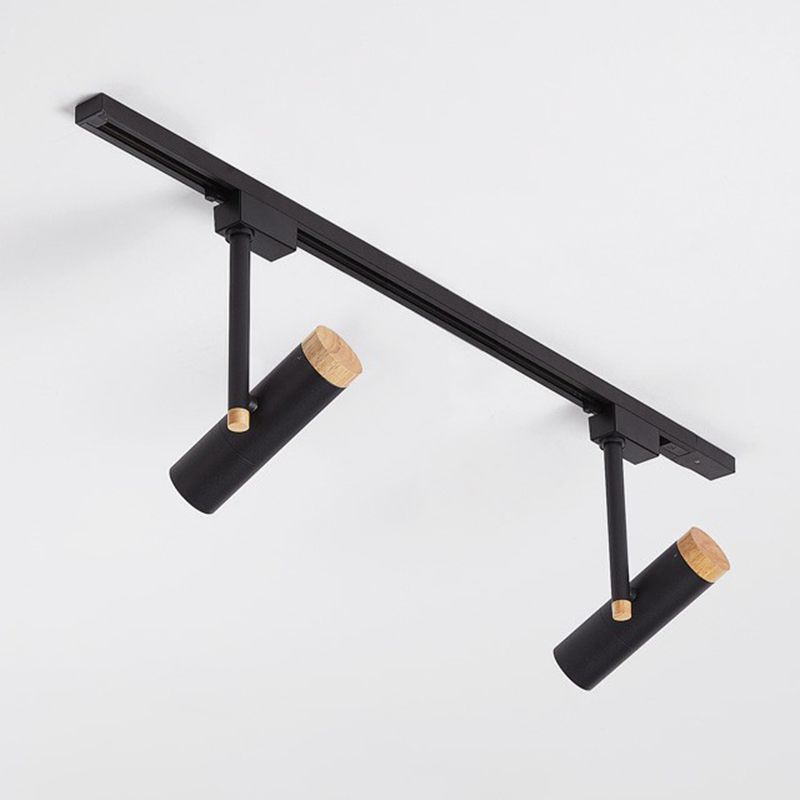 Black two-head ceiling spotlight rail with angled cylinders and wood rear caps