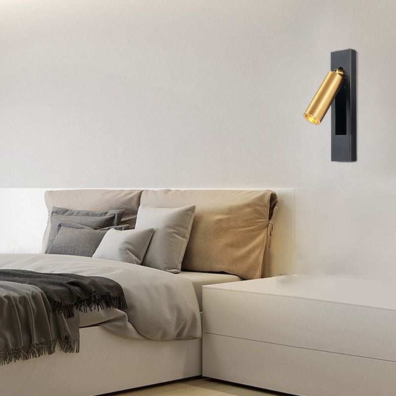 Orr gold-colour head and dark wall plate beside a bed