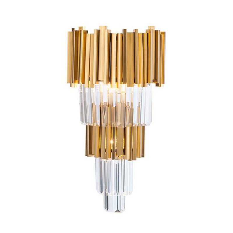 Kristy M descending tiers of gold-tone vertical pieces and clear faceted prisms