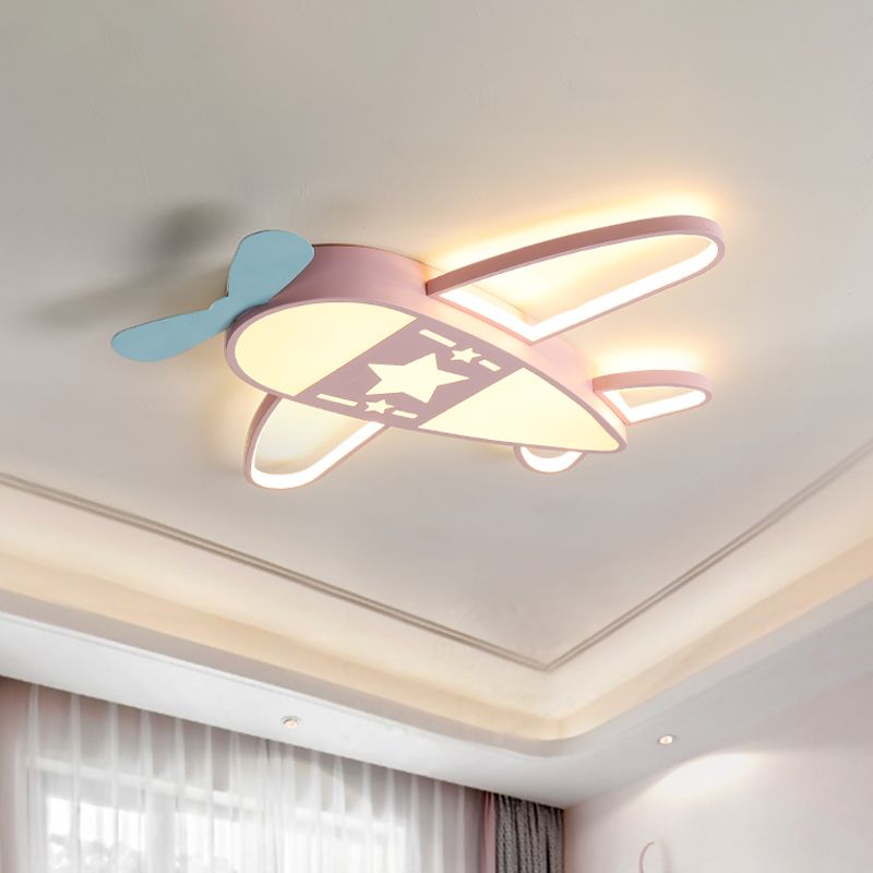 Pink Morandi airplane ceiling light with a blue decorative propeller, lit above a room with curtains.