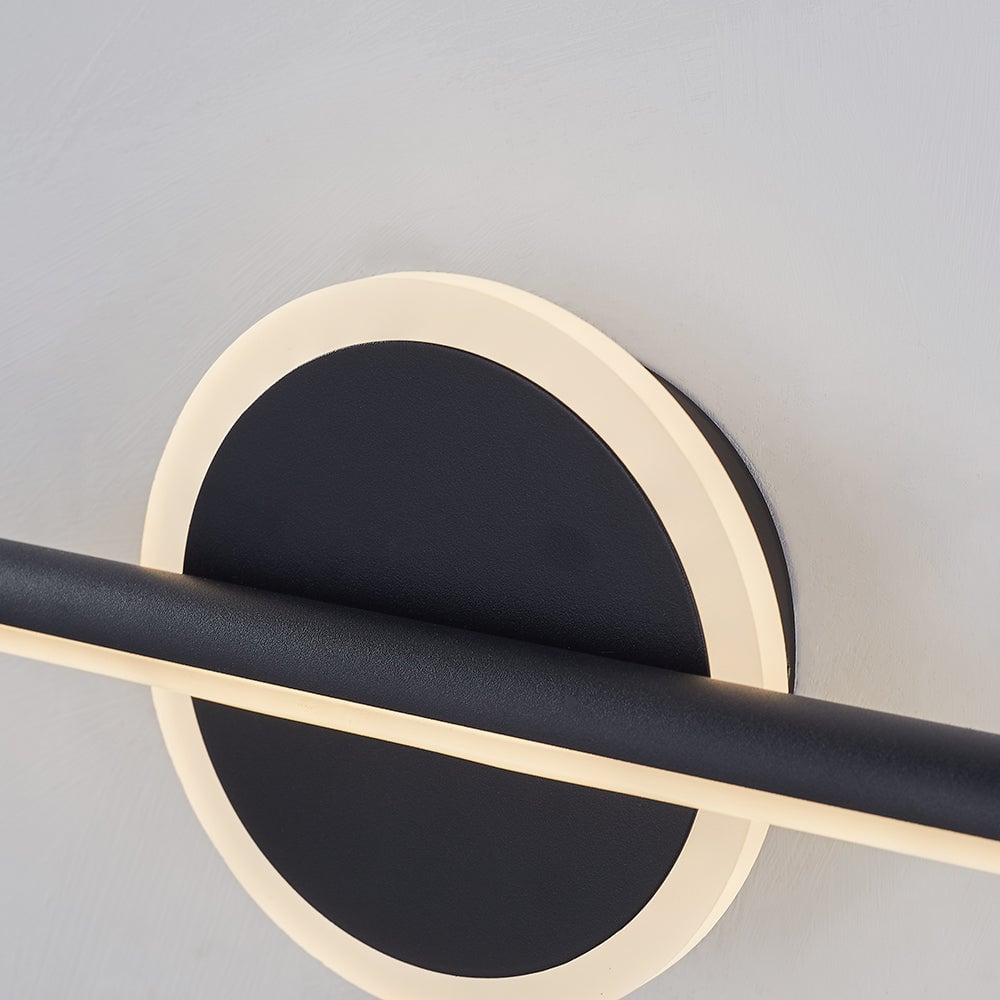 Black circular centre with a luminous border and crossing light bar