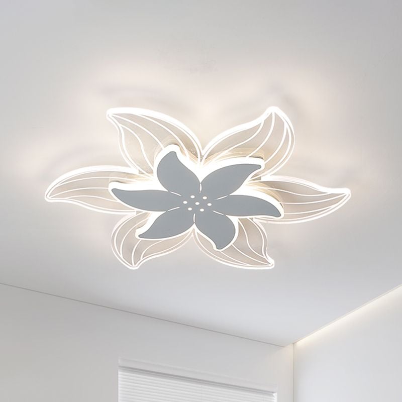 Warm Light Hana flower flush mount glowing above a room corner with curtains.