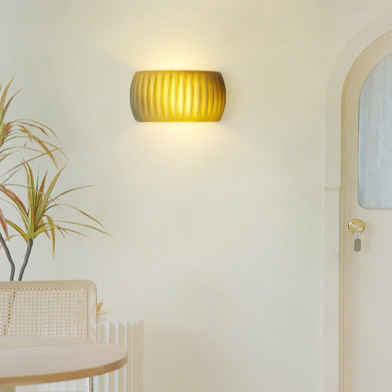 Green-finish ribbed Hailie wall light beside a doorway
