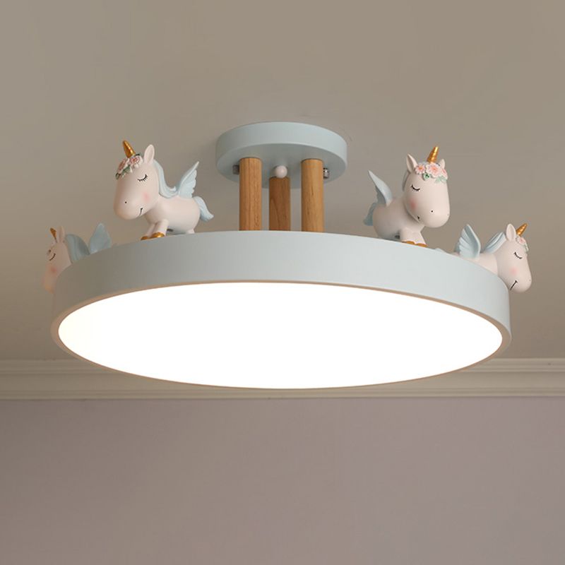 Pale blue unicorn ceiling light with wood-tone posts and an illuminated round underside