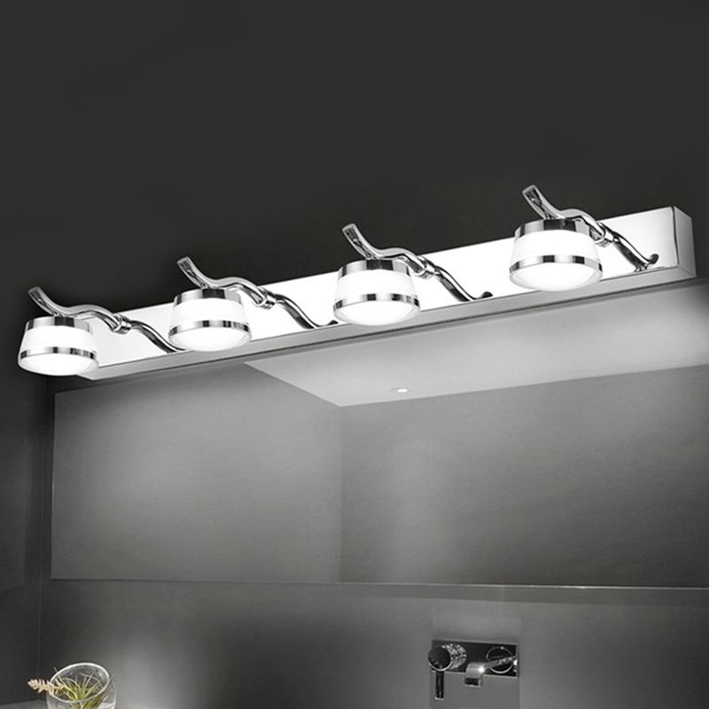 Close view of four illuminated Leigh light heads above a dark mirror wall.