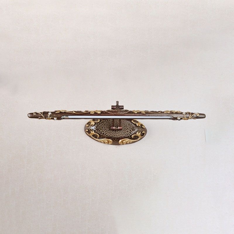 Red-brown Félicie light bar with gold-coloured scrolling decoration