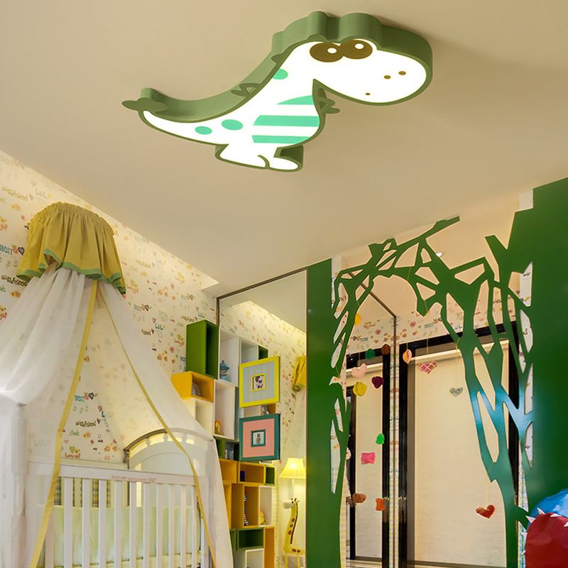 Green Freja dinosaur ceiling light in a room with a tent and tree-themed wall decor.