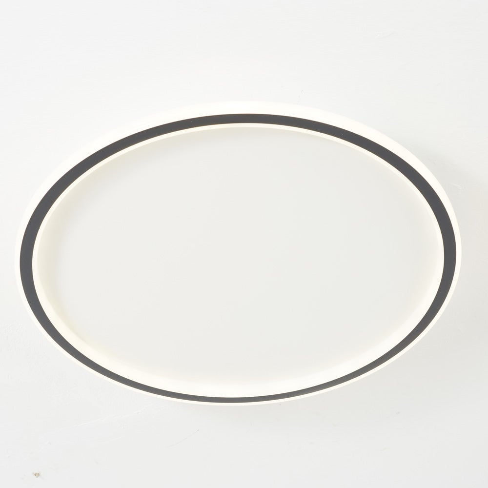 Close view of a Black-edged ceiling ring with a bright White illuminated rim and open center