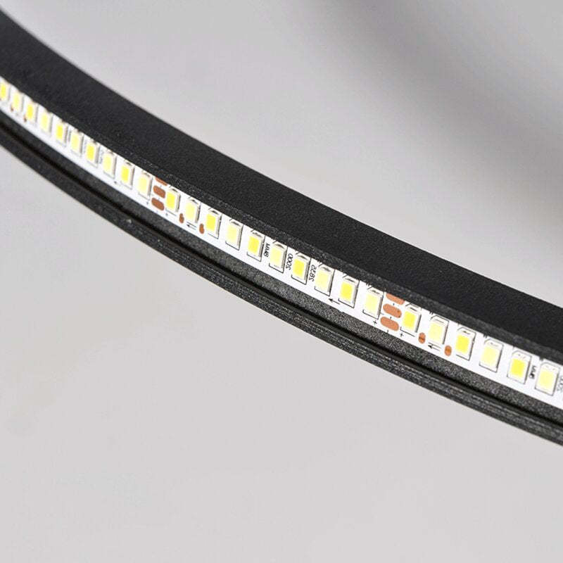 Detail of an exposed LED strip with Yellow LED packages and copper pads inside a Black ring channel
