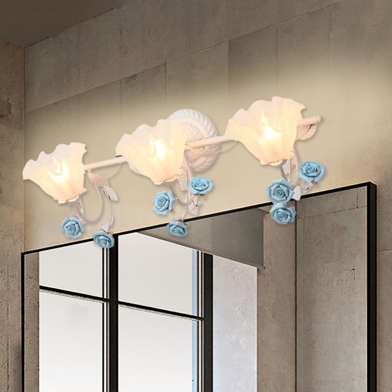 Félicie 3-Light Blue option above a rectangular mirror