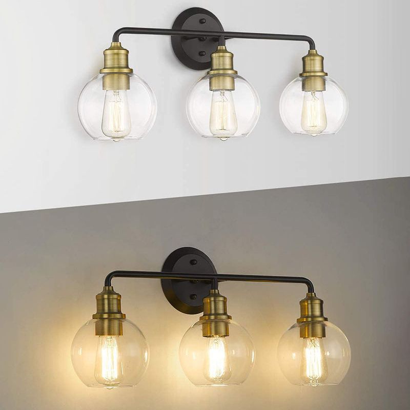 Alessio three-light fixture shown unlit and with a warm photographed glow