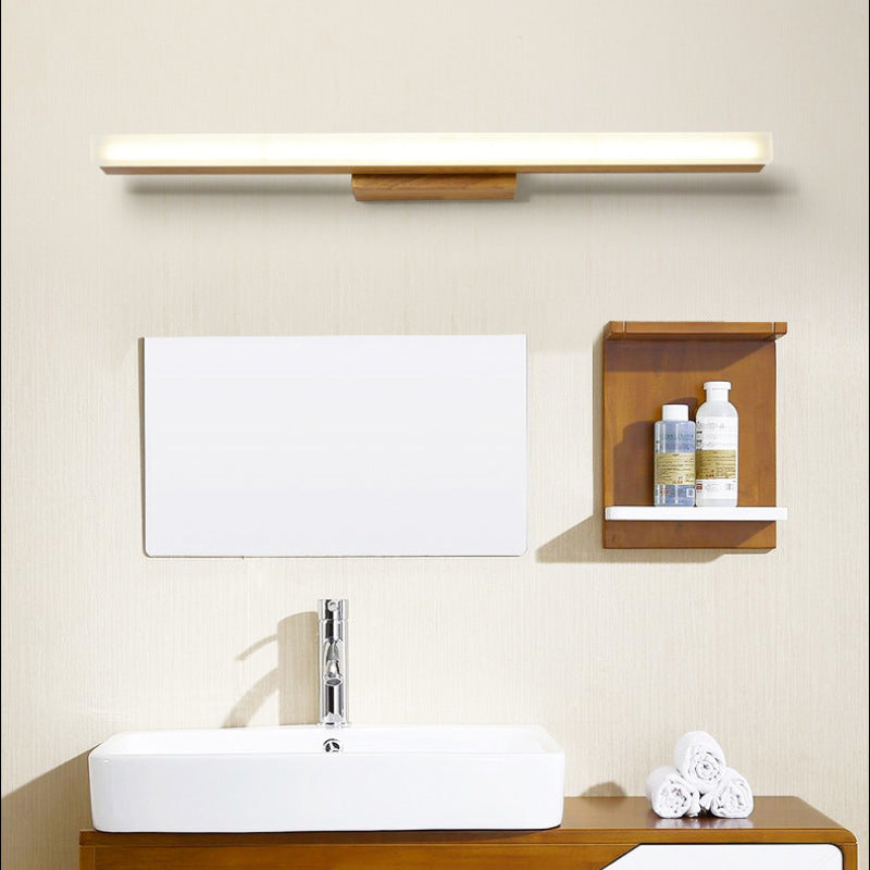 Long wooden LED bar above a rectangular bathroom mirror