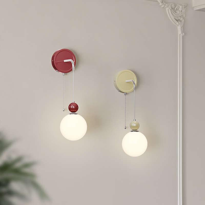 Red and pale Model C hanging globe lights