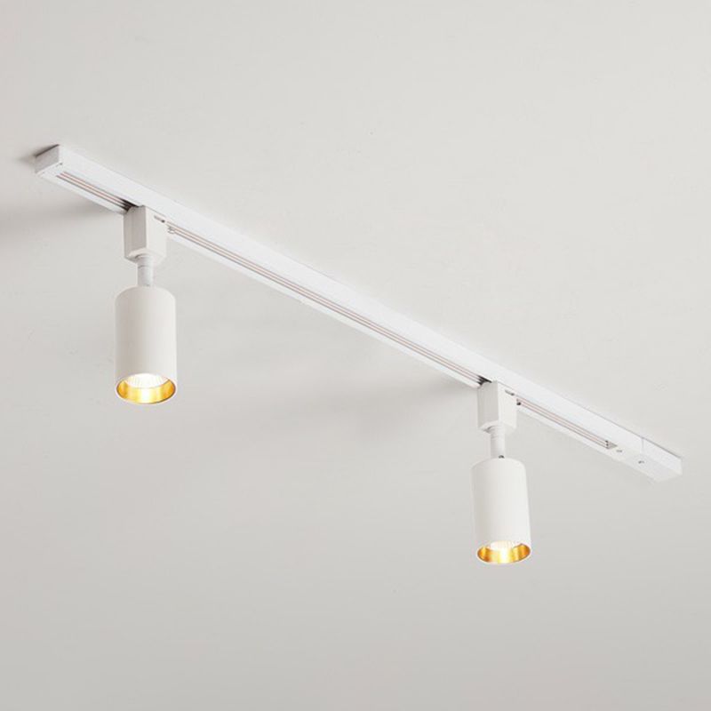 Small white two-head ceiling spotlight with short cylinders and gold-tone interiors