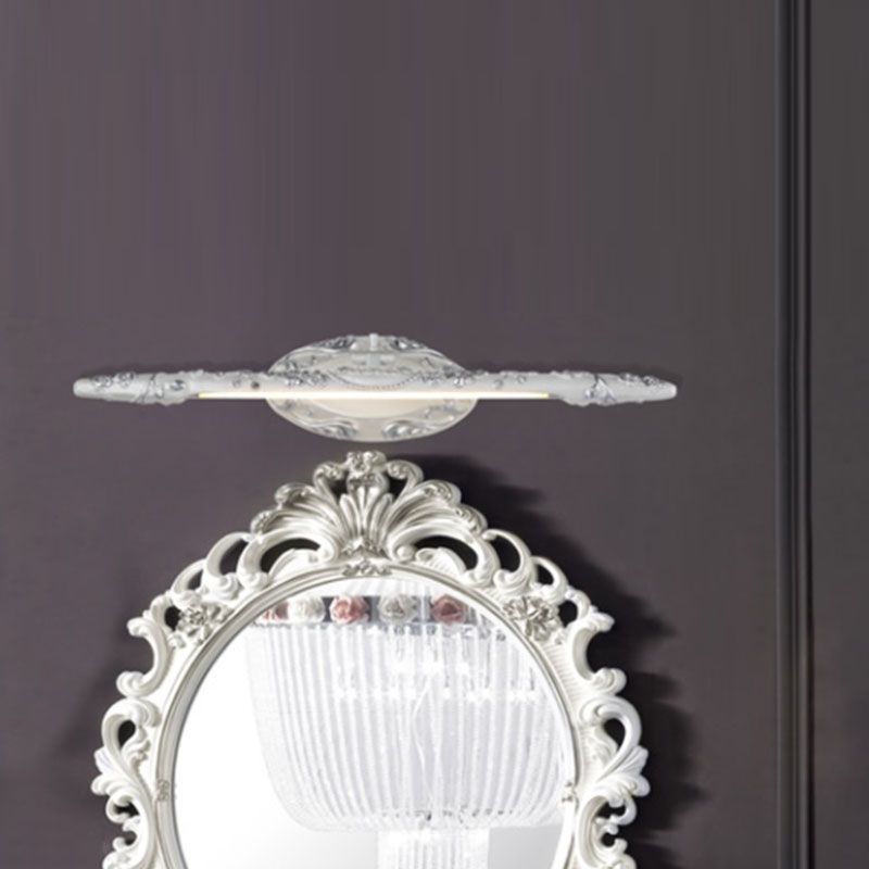 White-silver Félicie light bar above a white ornamental mirror