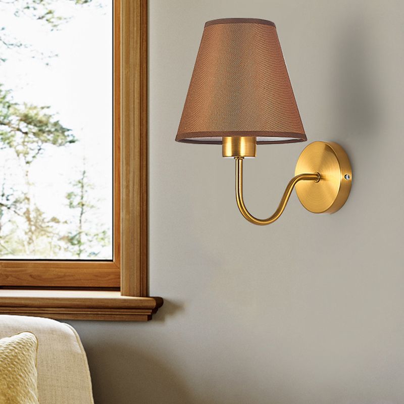 Eryn Coffee shade wall lamp beside a window