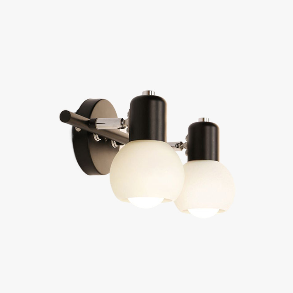 Black Valentina two-globe wall light with cylindrical holders, reflective joints and round plate on white