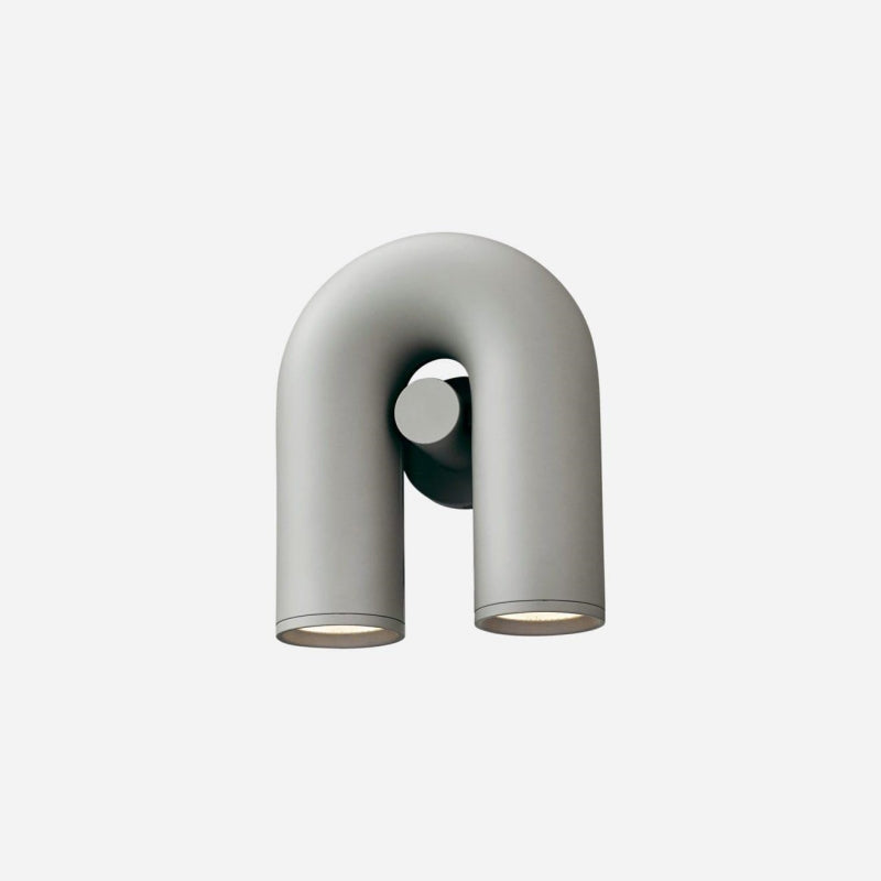 Gray U-shaped fixture isolated on white, rounded arch, central boss, round backplate and two circular lower ends