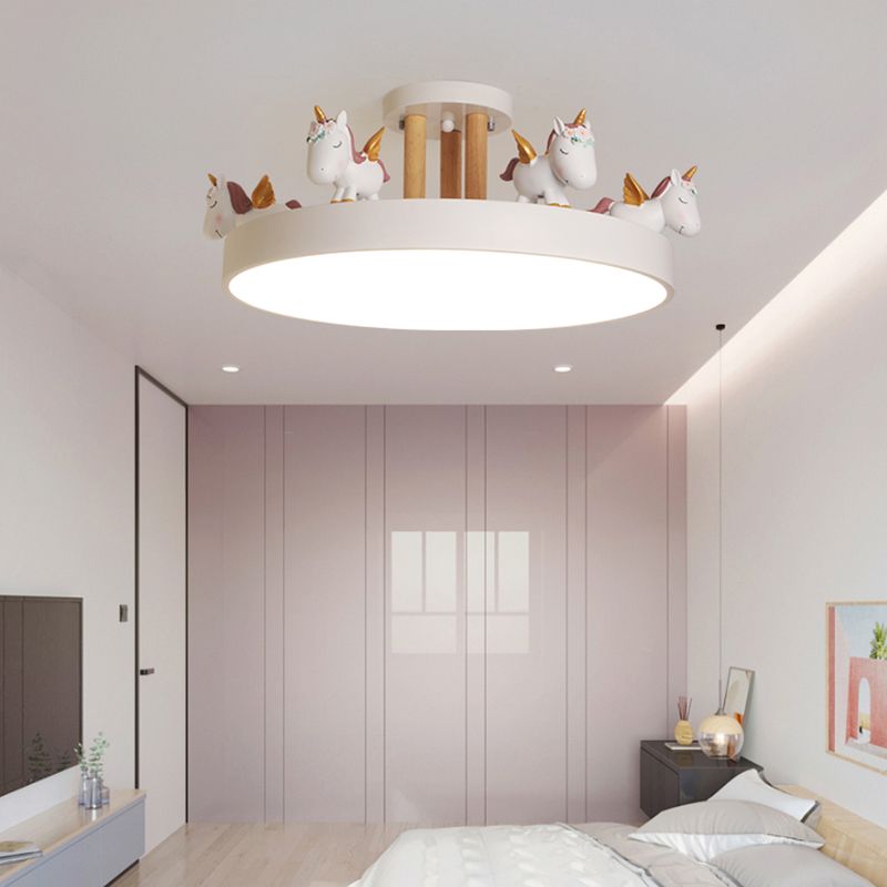 White unicorn ceiling light with wood-tone posts above a bed, pale wardrobes and television