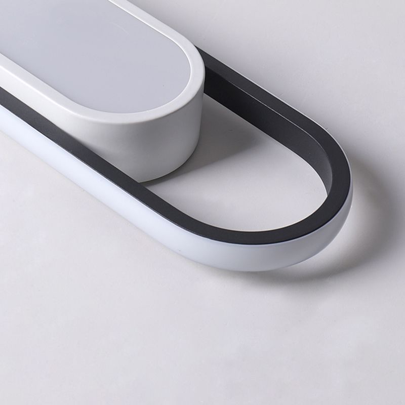 Close unlit rounded end showing pale outer frame, dark inner edge and open space beside the frosted panel