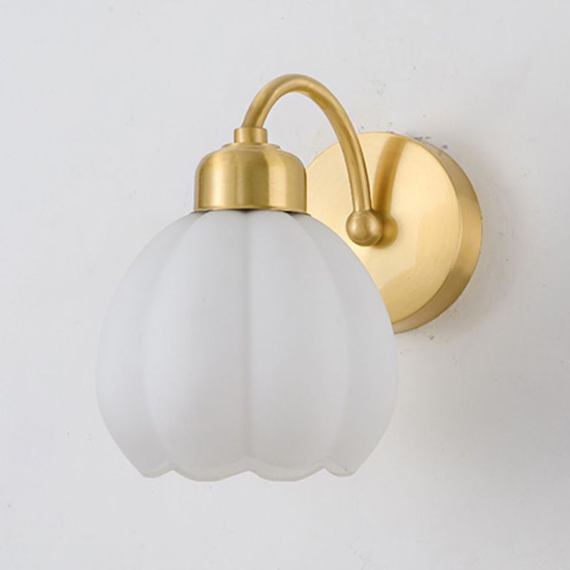 Unlit white glass wall-light shade with vertical lobes, scalloped rim and gold-tone curved arm