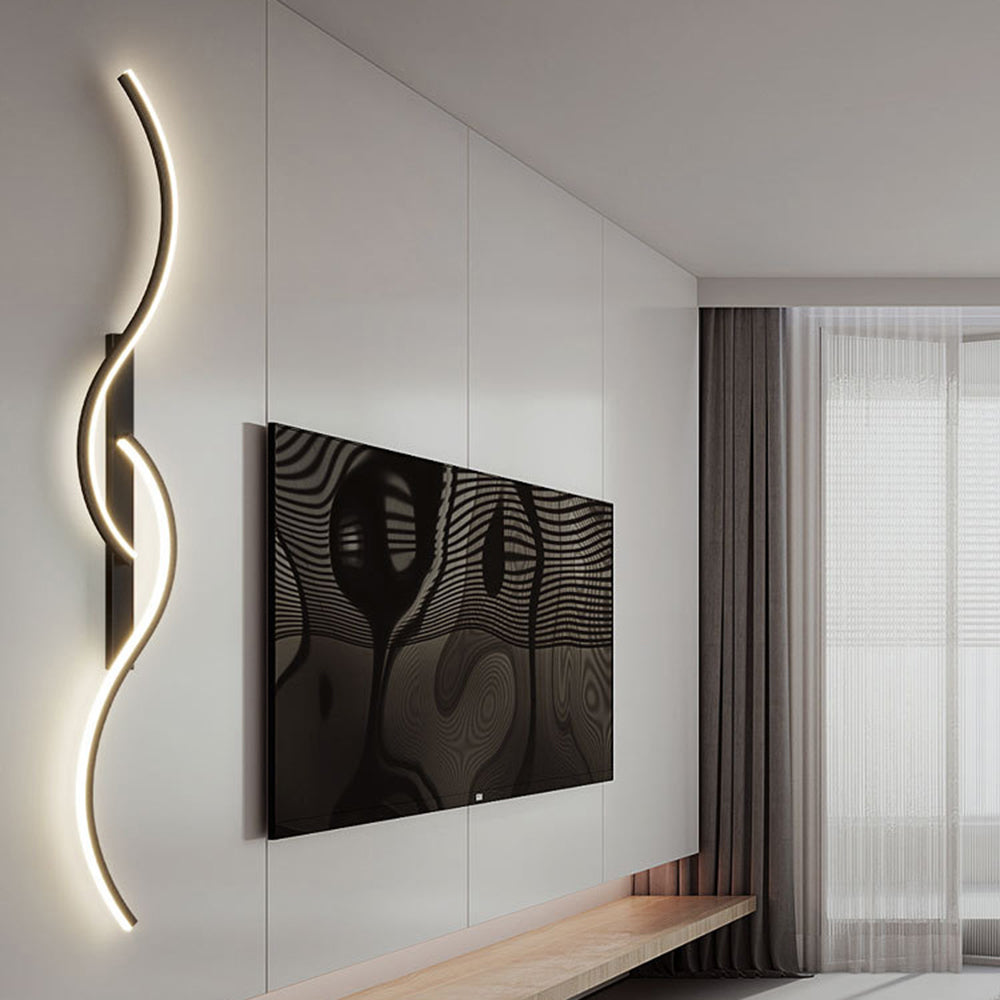Black vertical Louise light beside a television on a white wall, above a wood console near curtains