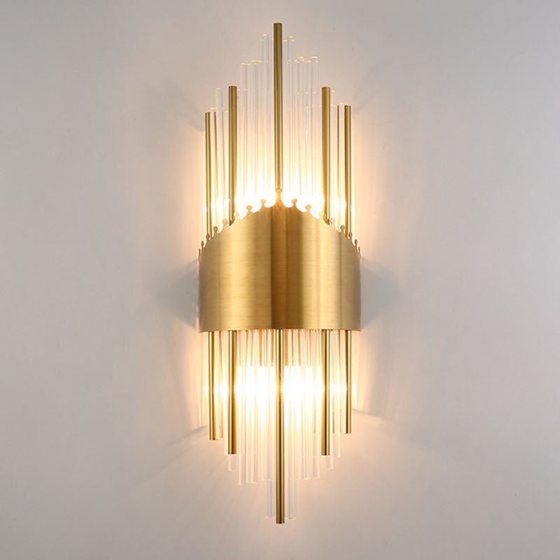 Kristy H mixed clear and gold-tone rods with a crown-edged central band on a pale wall