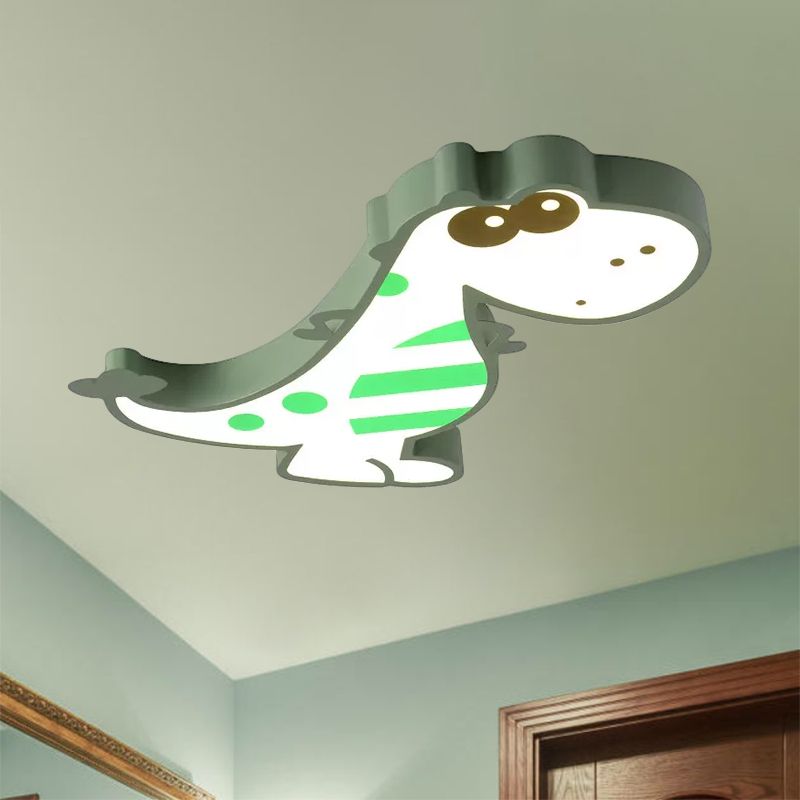 Green Freja dinosaur ceiling light with striped body details, viewed below the ceiling.