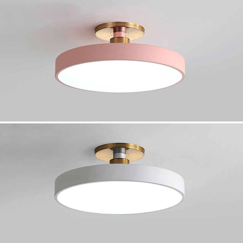 Two-panel comparison of pink and white round ceiling fixtures with white diffusers and gold-tone fittings