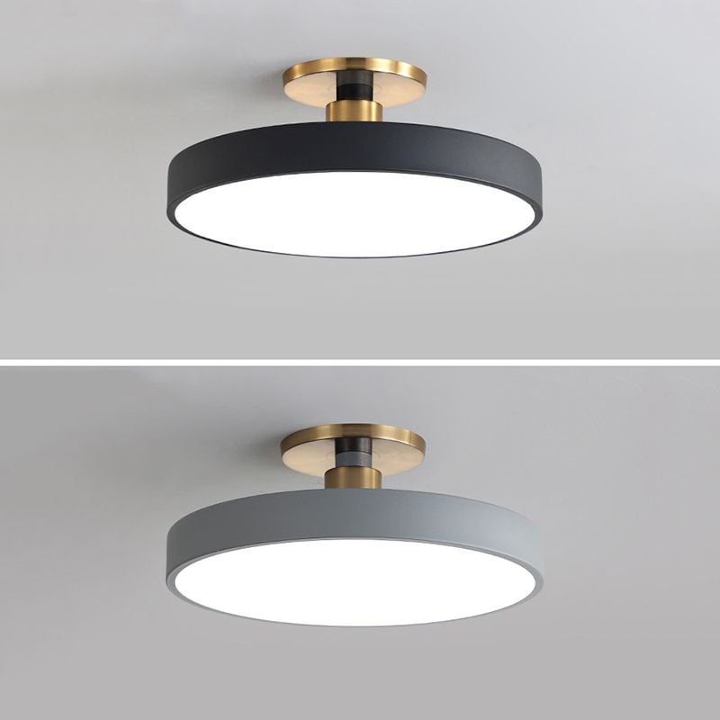 Two-panel comparison of black and gray round ceiling fixtures with white diffusers and gold-tone fittings