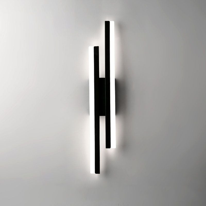 Black offset-bar wall light with the right bar starting higher and pale light faces