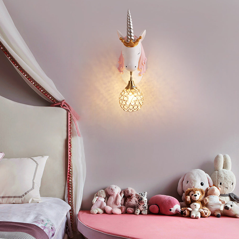 Pink-maned unicorn with rounded hanging shade on a bedroom wall near a canopy and stuffed toys