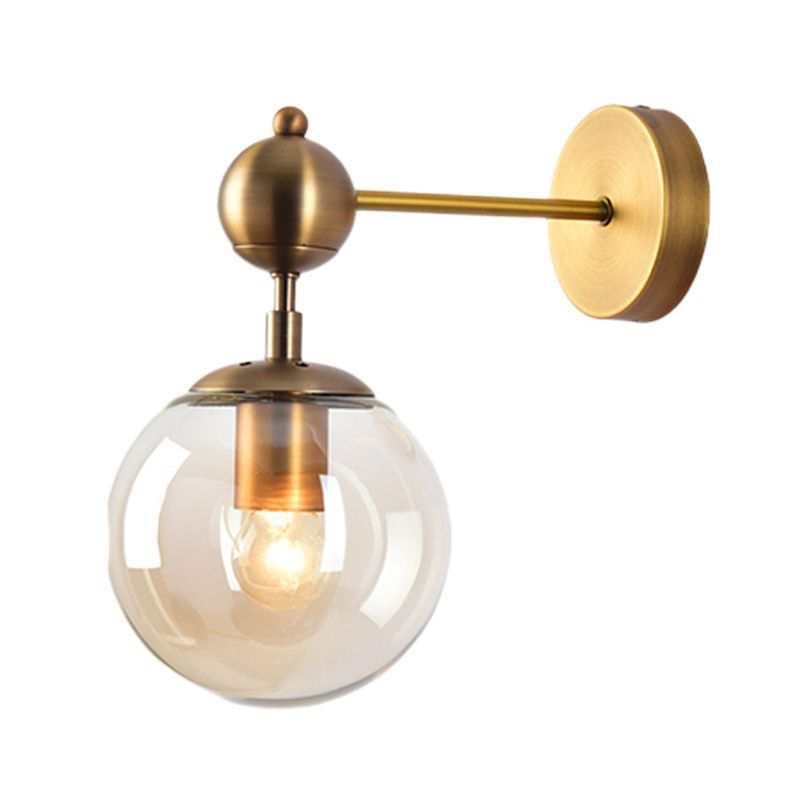 Isolated Gold Valentina single hanging globe with visible bulb and round backplate