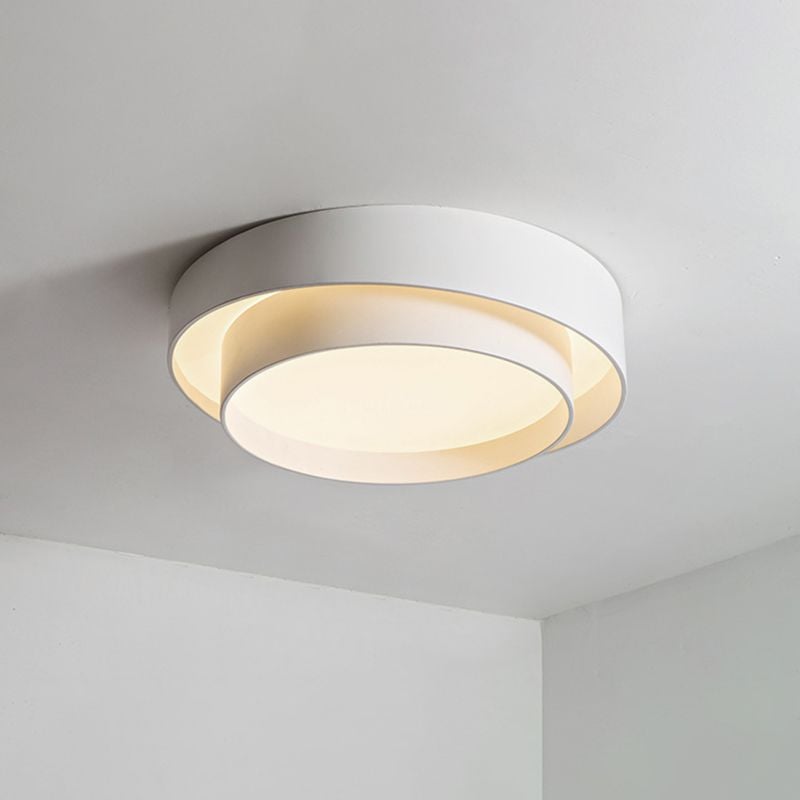 Quinn white circular ceiling light viewed from below near a room corner.