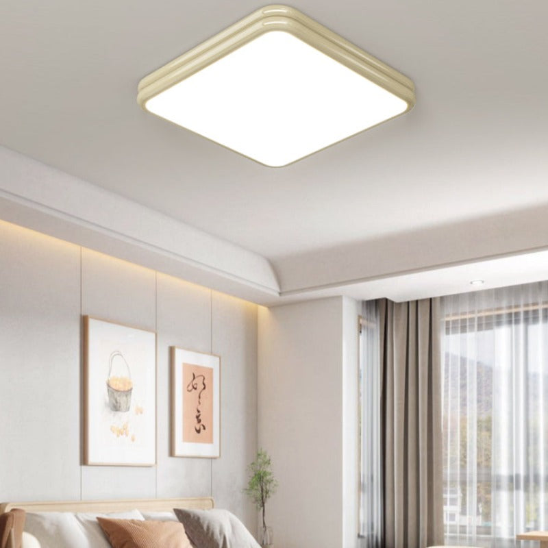 Cream-yellow square Valentina ceiling light above a seating area