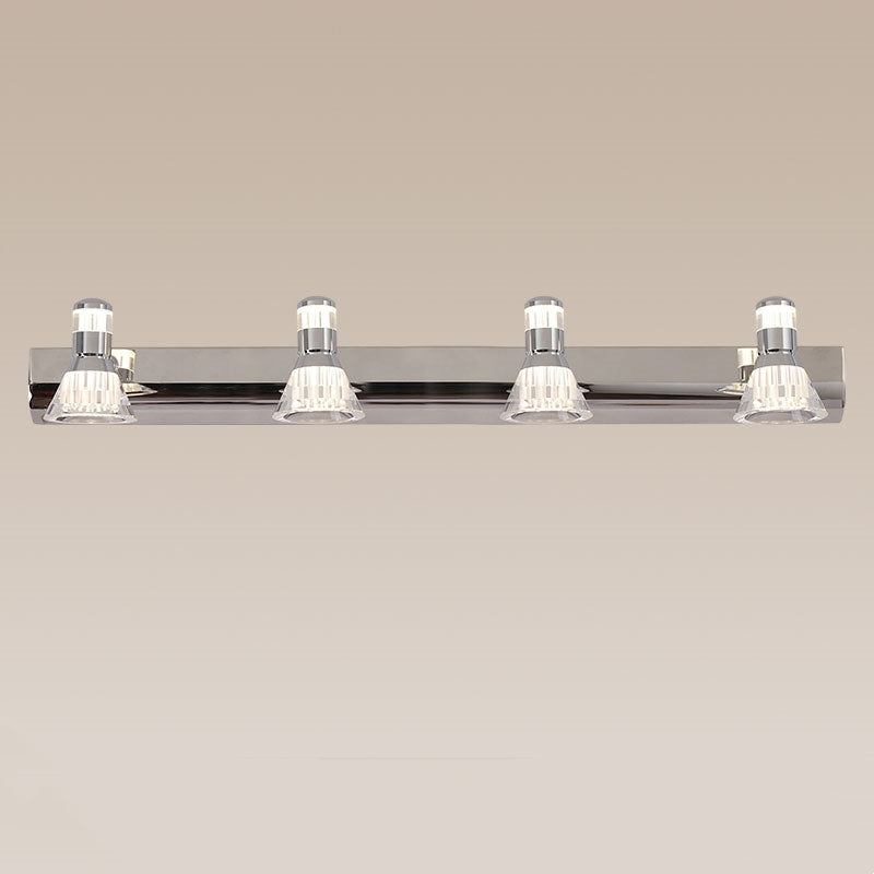 Kristy four-head silver fitting on a beige background with clear conical heads and a rectangular backplate