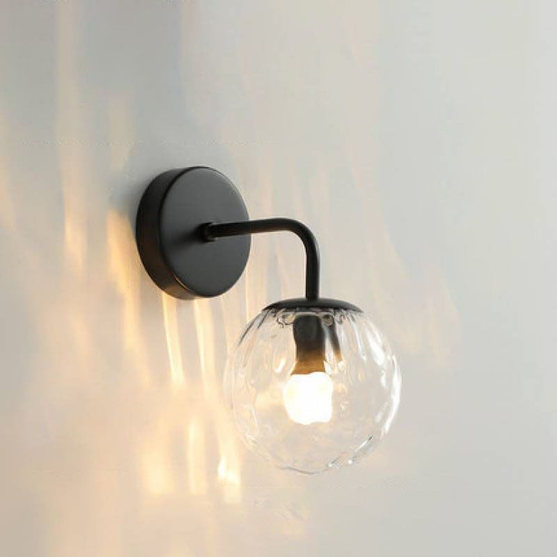 Valentina black wall lamp with illuminated textured clear globe