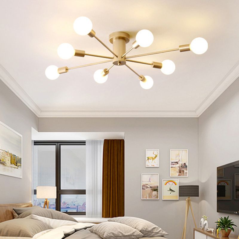 Gold eight-light ceiling fixture above a bedroom with bed, window, picture wall and television