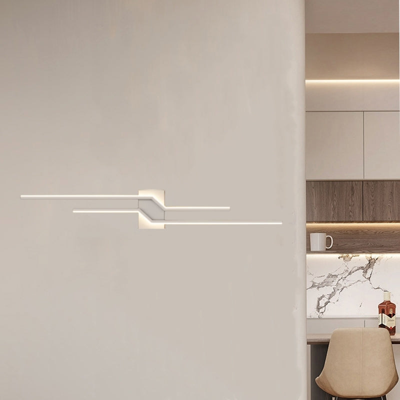 White Alana wall light with offset lines on a pale interior wall