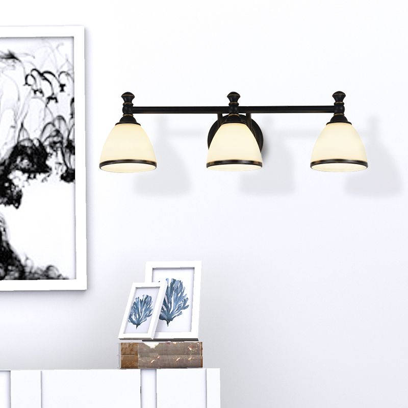 Eryn three-light wall lamp beside framed artwork