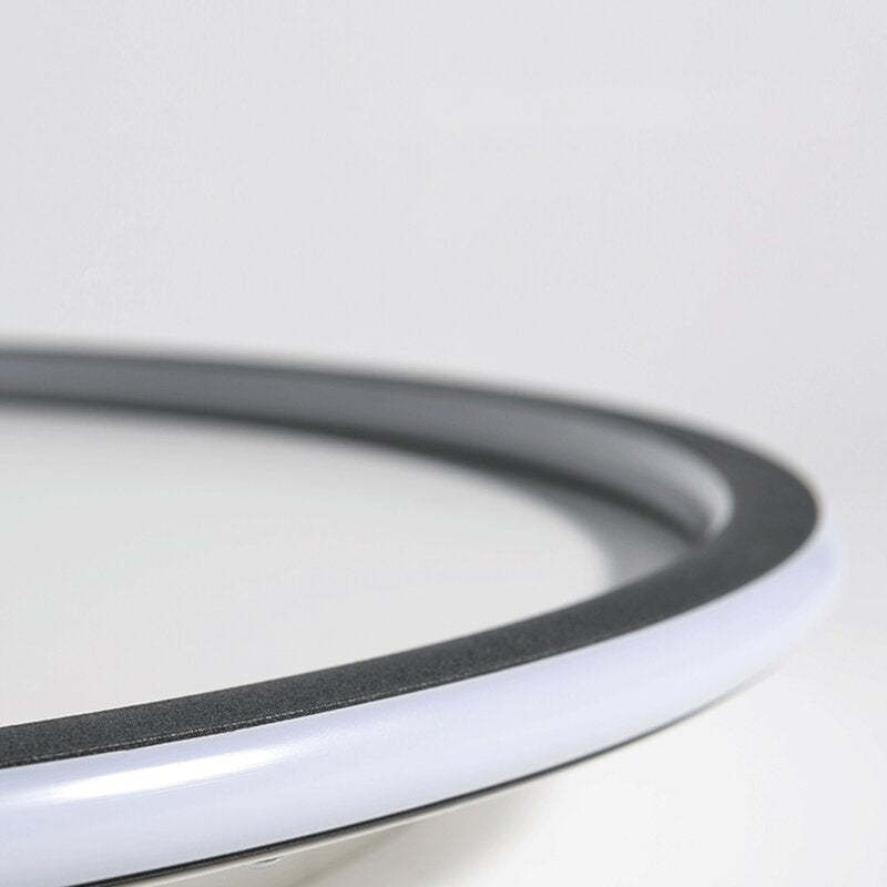 Detail of the curved Black ring frame and White acrylic diffuser against a pale background