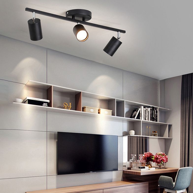 Black Freja three-head spotlight above television shelving