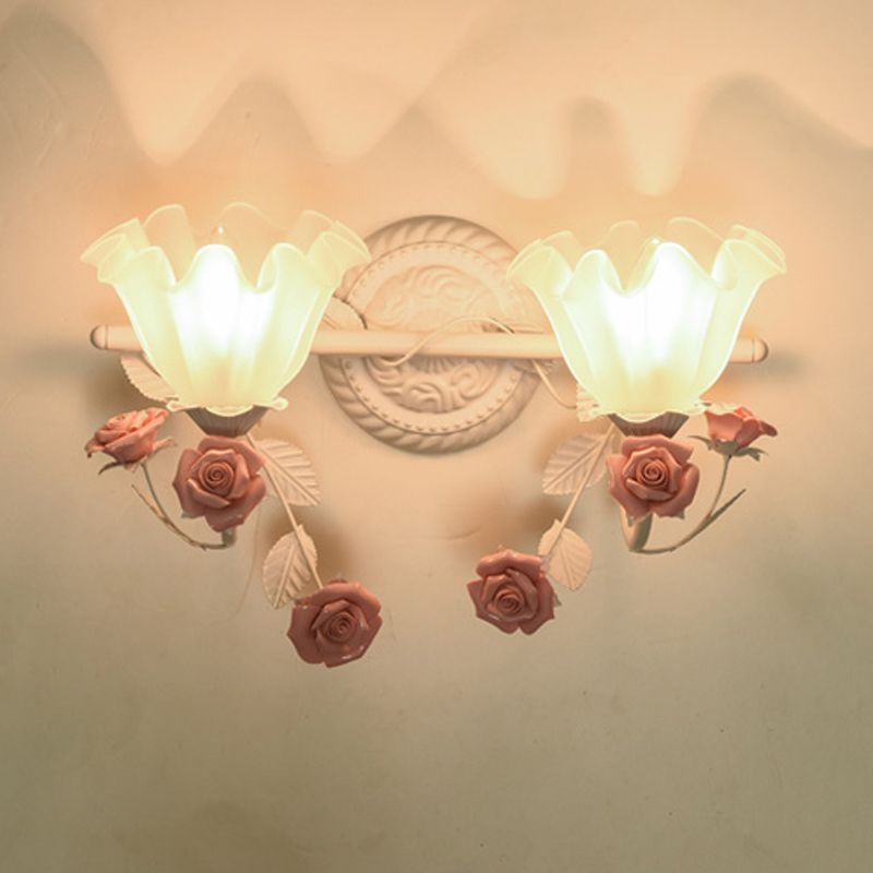 Félicie two-light pink rose design pictured with upward illuminated shades