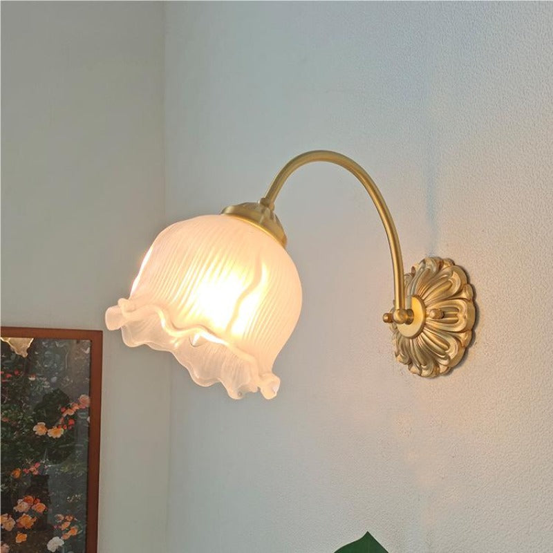 Bella ribbed bell shade illuminated beside framed art