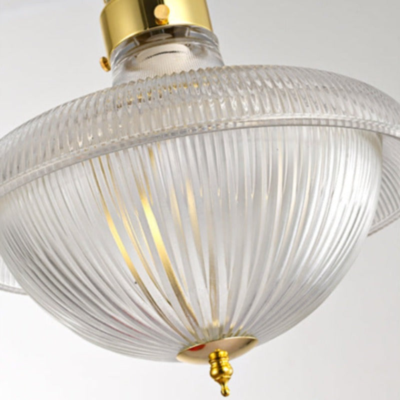 Close-up of the Alessio ribbed glass bowl and gold-toned bottom finial.