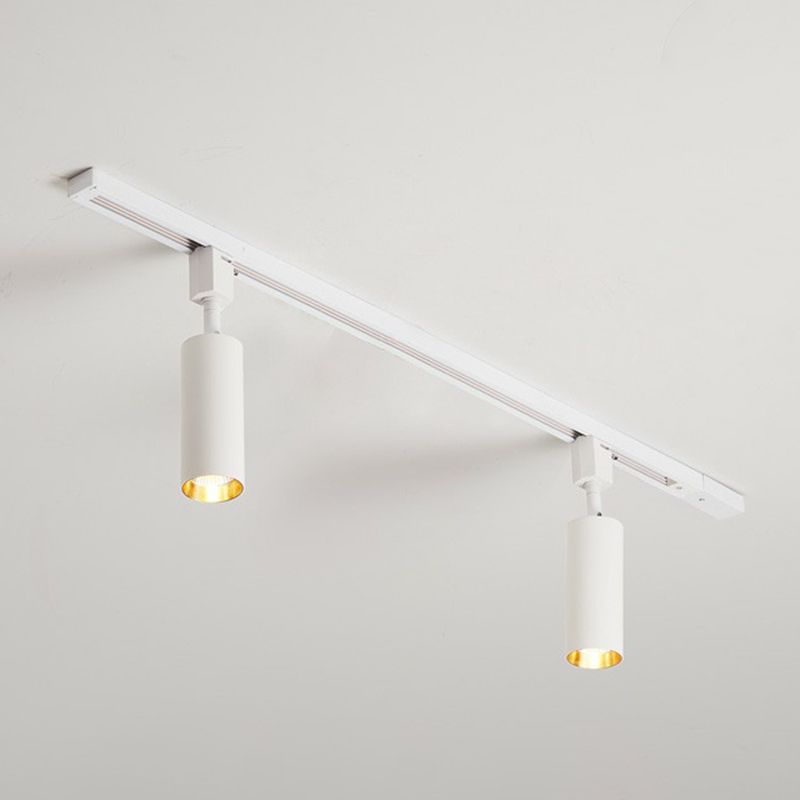 Large white two-head ceiling spotlight with longer cylinders on a white rail