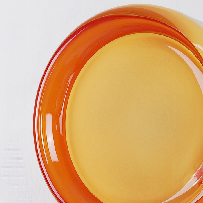 Close-up of the glossy amber circular rim surrounding a pale central disc