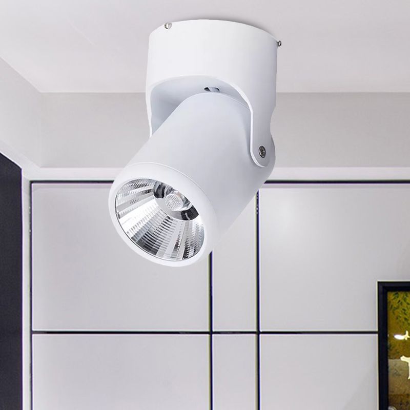 Close-up of the white Novak pivoting spotlight and reflective cone above a room divider